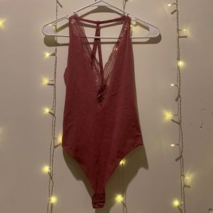 NEW with tags. Express Purple XS bodysuit with lace design.